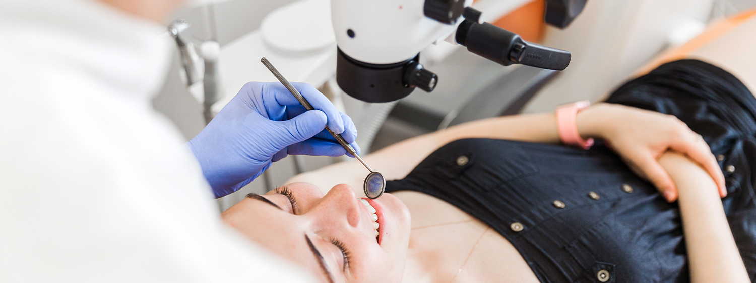 dentist up close to patient and theyare smiling in Des Moines IA