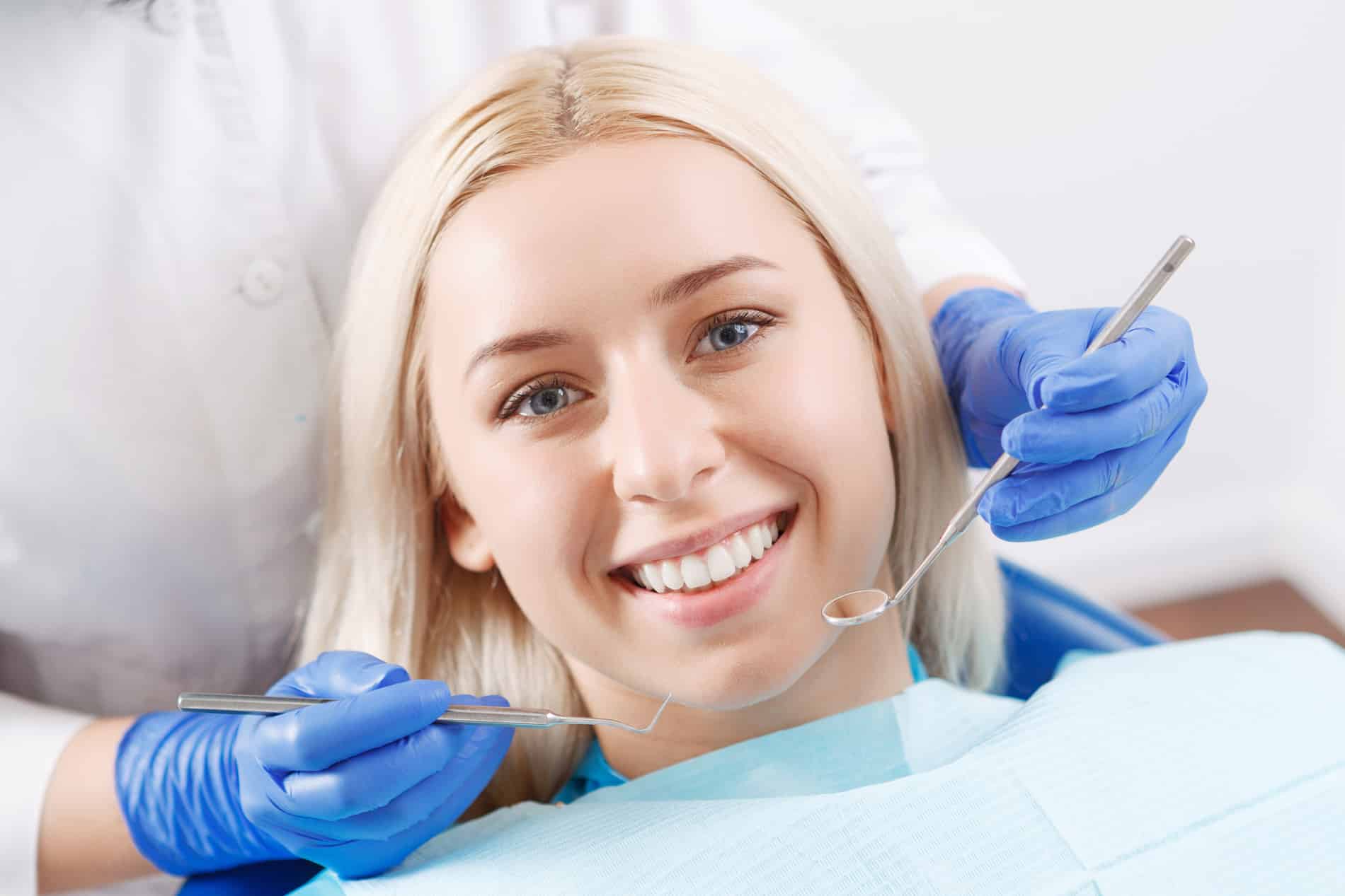 AdobeStock_85924661 v2 Woman smiling at her restorative dental appointment in Des Moines IA