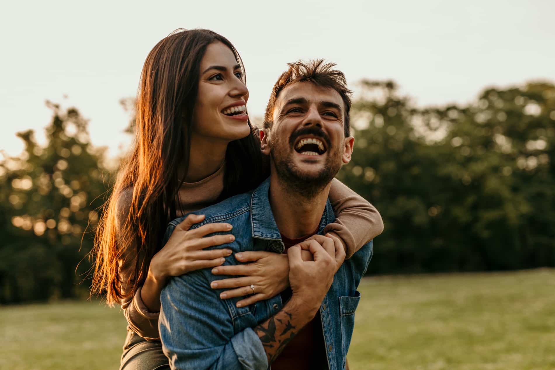 AdobeStock_1571758096 v2 Couple smiling because they had a short visit with same day dental crown in Des Moines IA