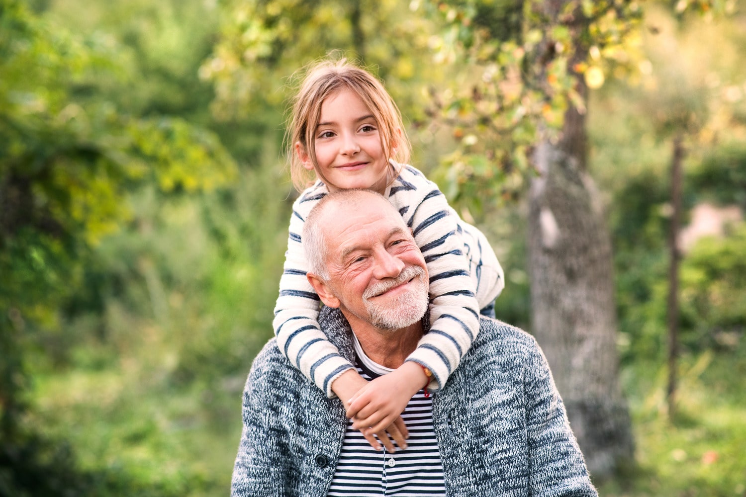 Family smiles with healthy teeth protection from professional fluoride treatment in Des Moines